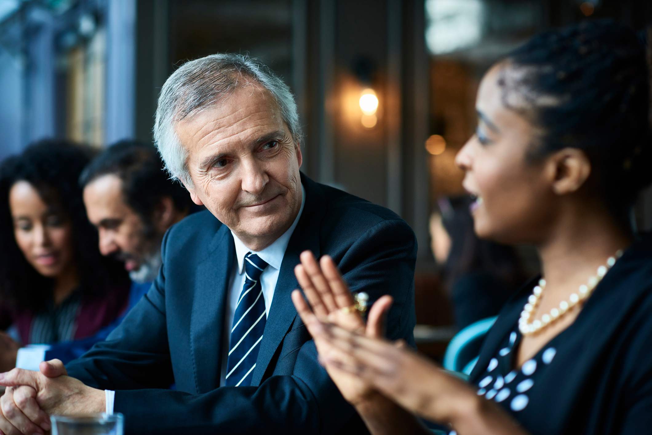 Man-listening-actively-to-coworker-passive-aggressive-boss