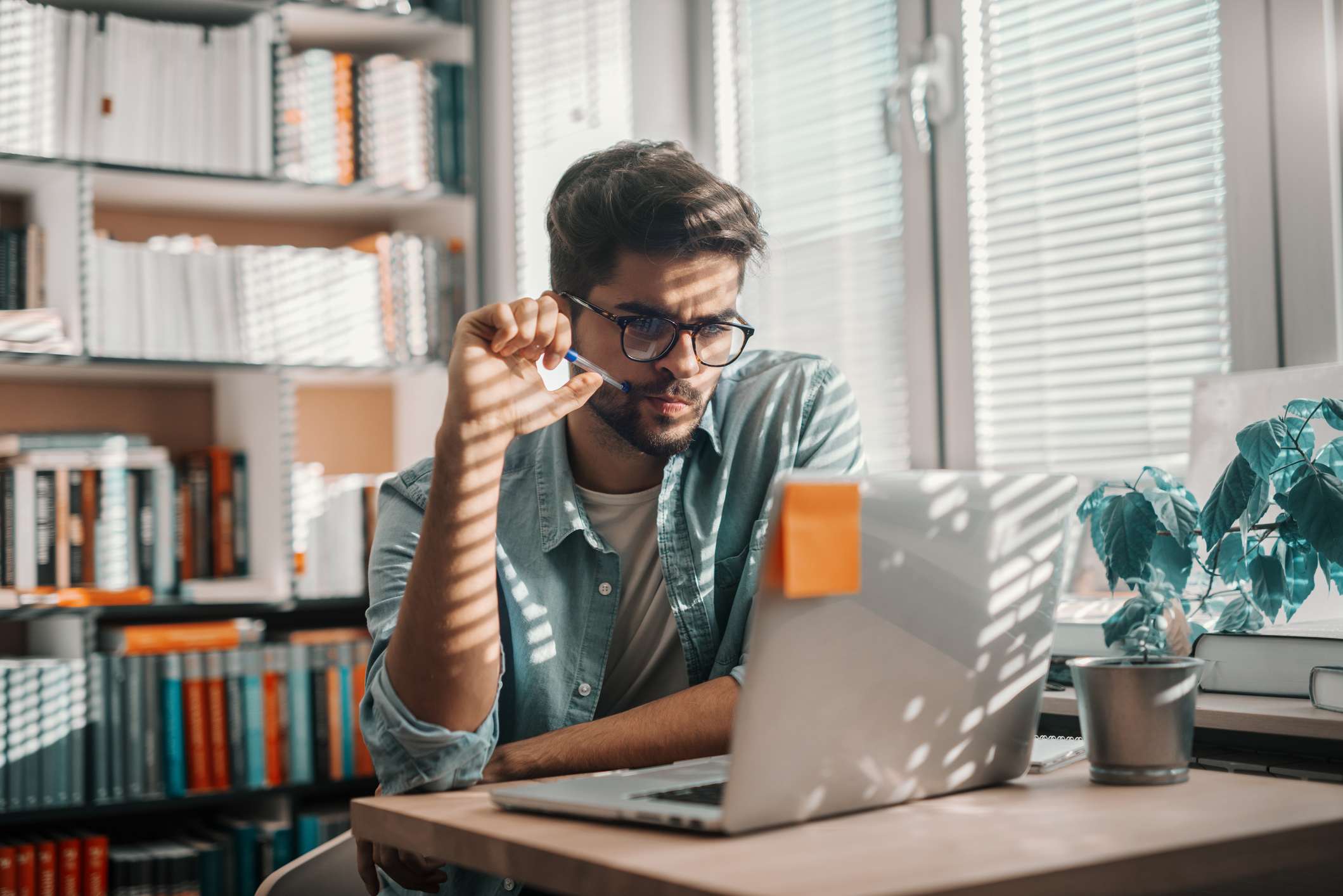 Man-researching-at-his-laptop-taking-a-sabbatical-from-work