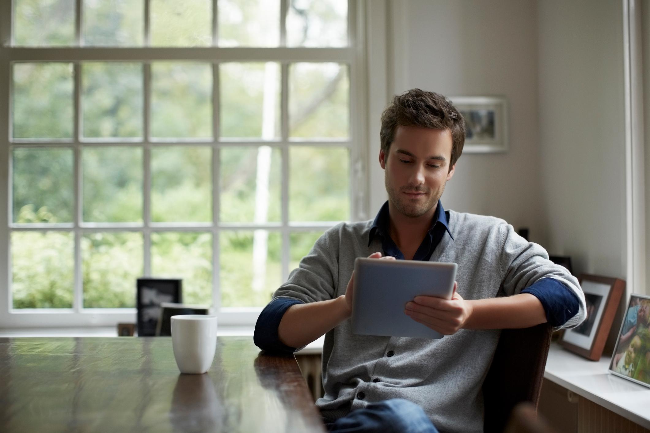 Man-using-digital-tablet-in-cottage-purpose-of-anger-emotion