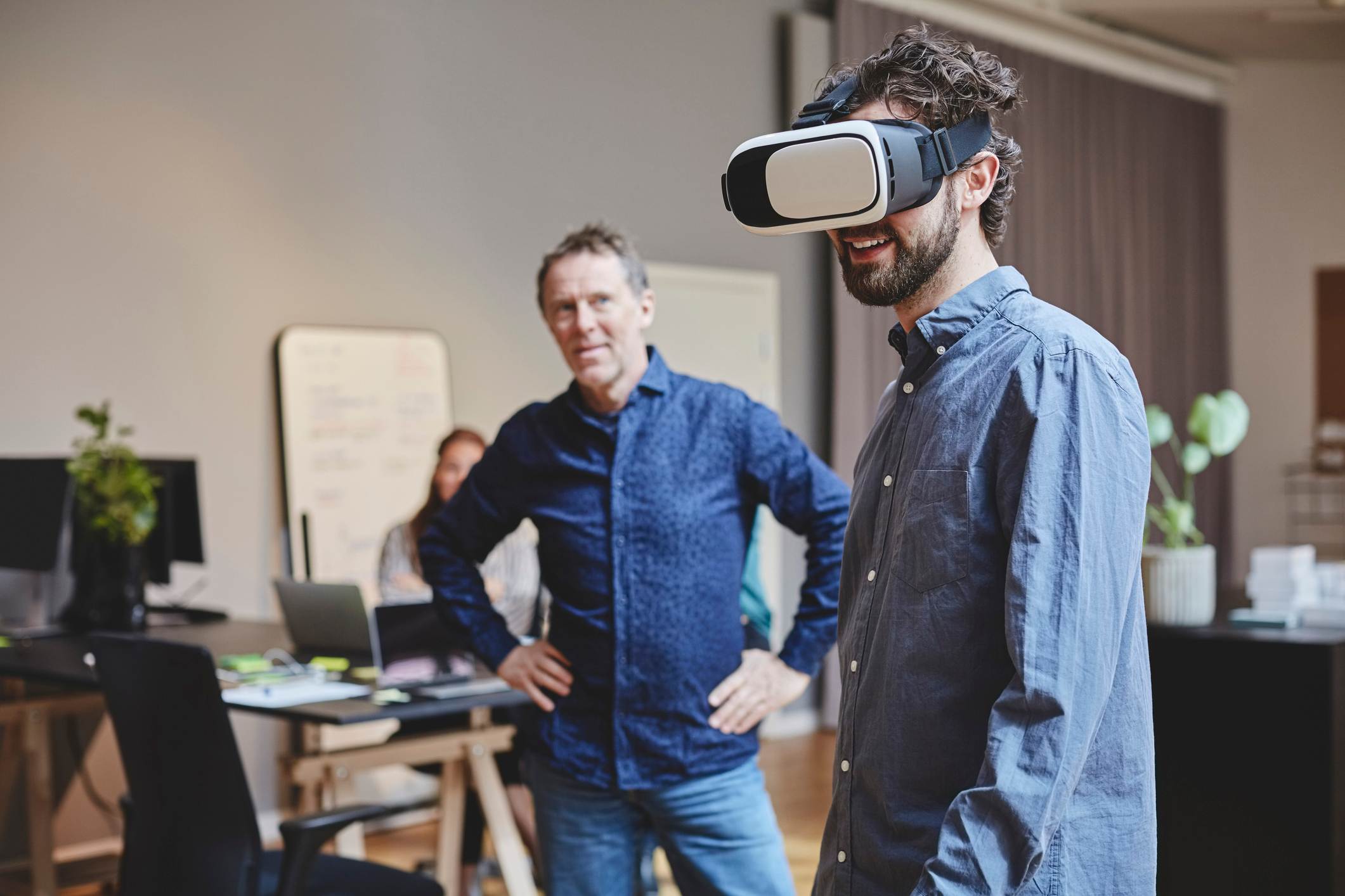 Man-using-virtual-reality-goggles-at-office-what-is-disruptive-innovation