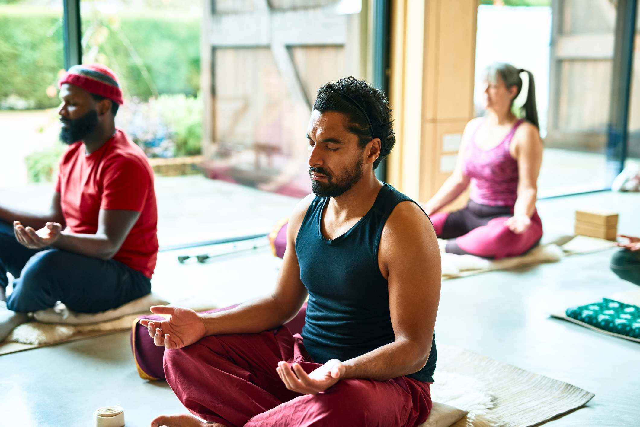 Man-with-eyes-closed-meditating-at-yoga-class-how-to-release-endorphins