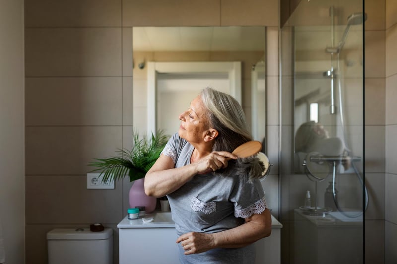 Mature-Woman-Brushing-Her-Hair-how-to-improve-self-esteem