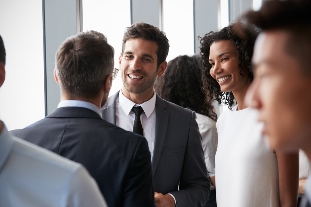 Men-smiling-to-other-man-with-a-woman-on-the-side-how-to-network