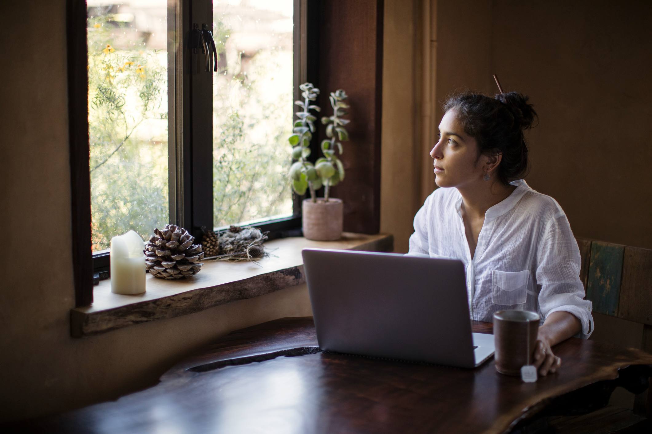 Mixed-race-Young-Adult-Woman-Works-at-Home-how-to-decide-between-current-job-and-new-job