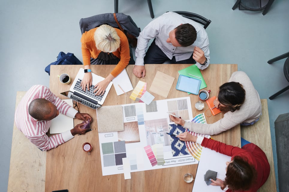 Overhead-Shot-Of-Designers-Planning-Project-In-Office-what-makes-a-good-team