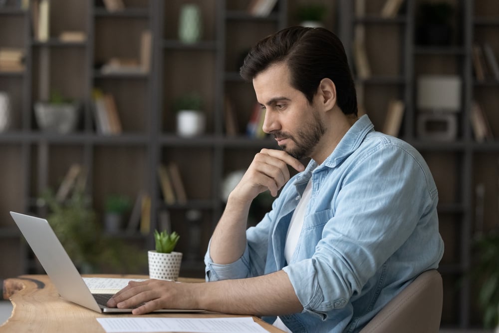 Pensive-millennial-Caucasian-man-sit-at-desk-at-home-how-are-personal-values-formed