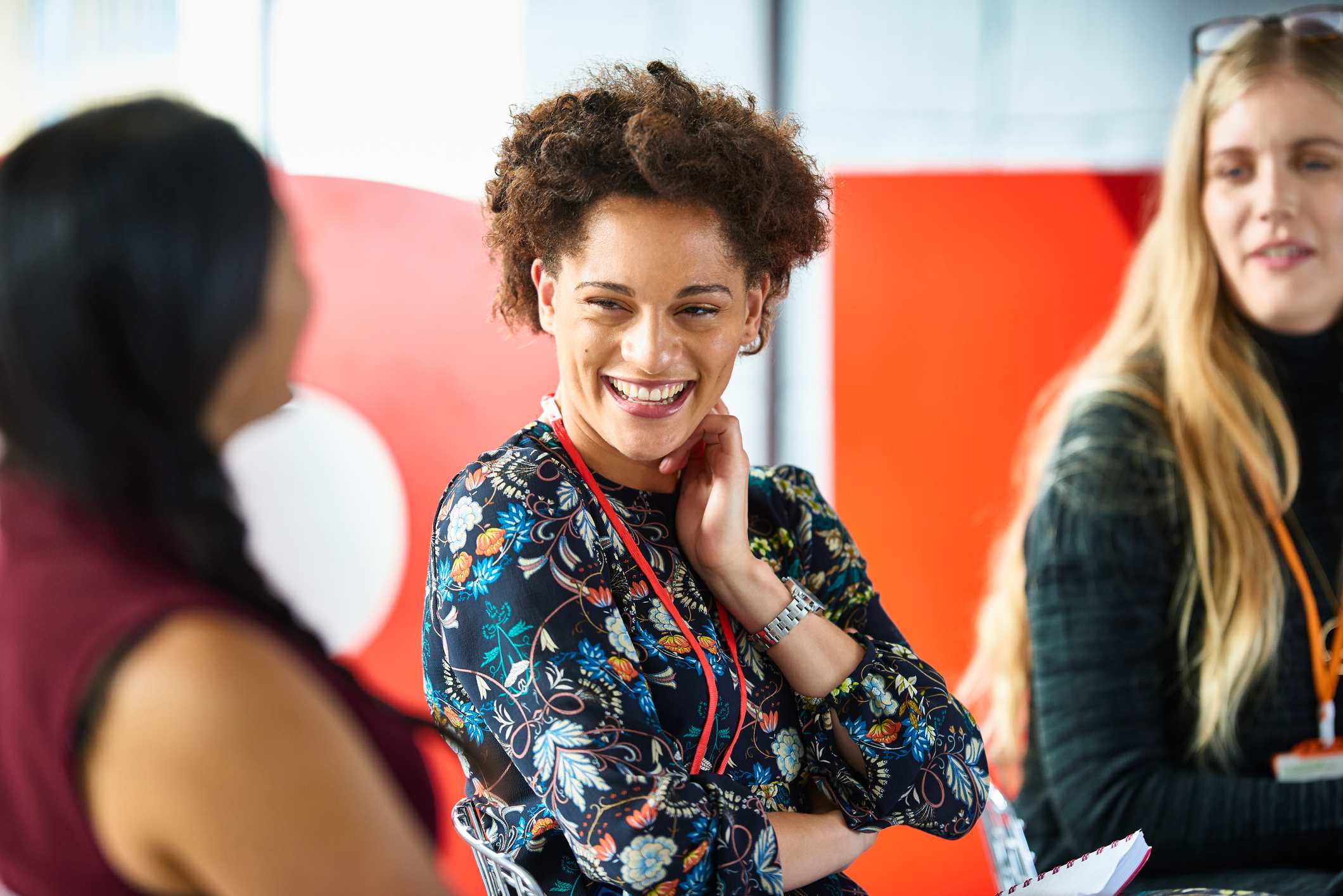 Positive-woman-smiling-during-meeting-types-of-adaptability-skills