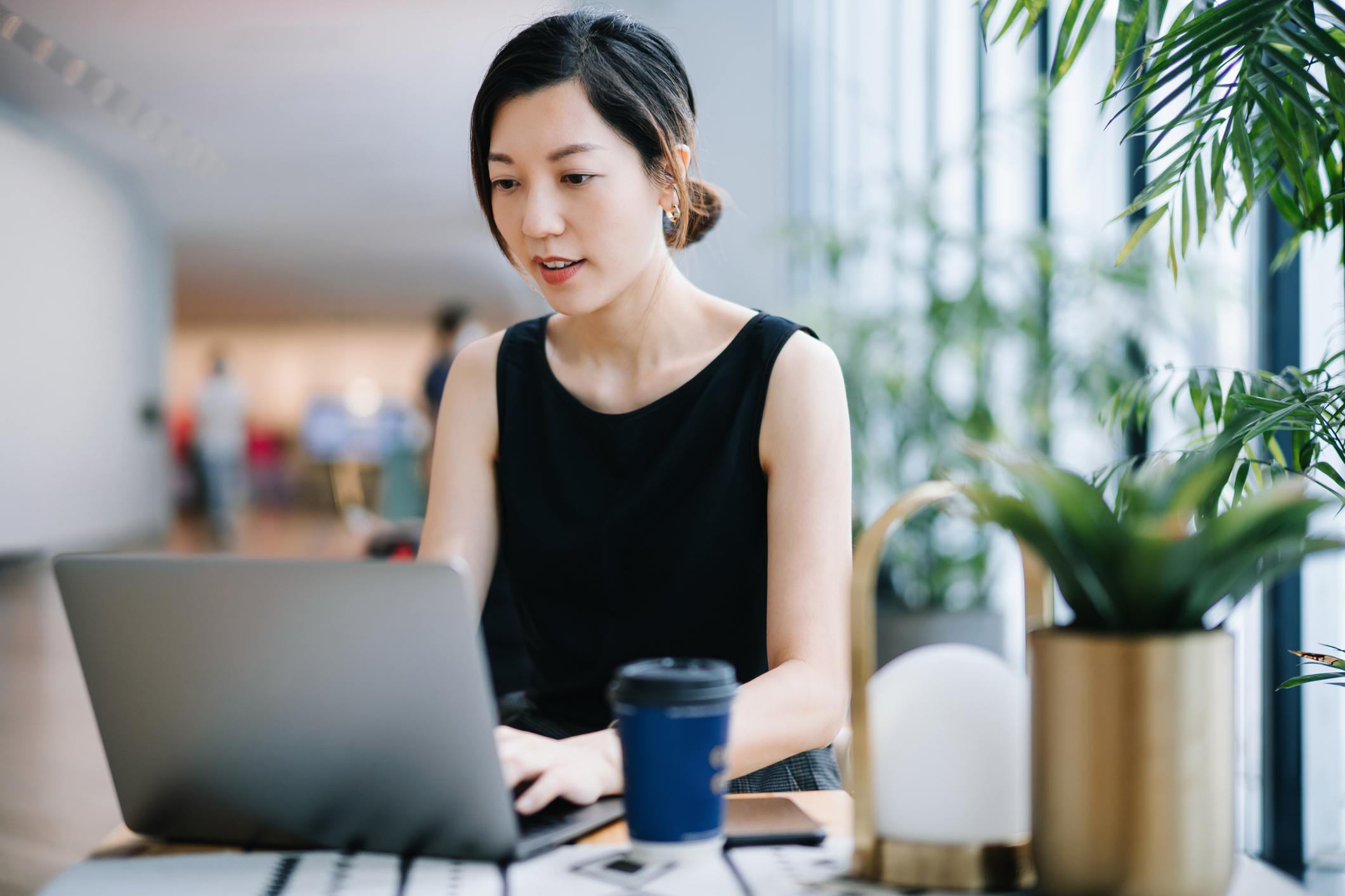 Professional-young-Asian-businesswoman-working-on-laptop-best-job-posting-sites-for-employers-3