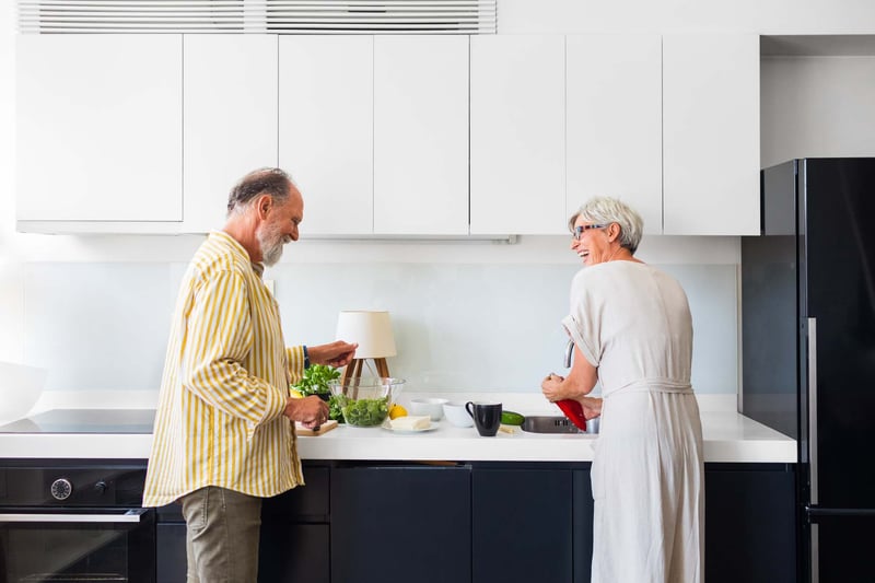 Senior-Couple-Laughing-In-Kitchen-how-to-be-present