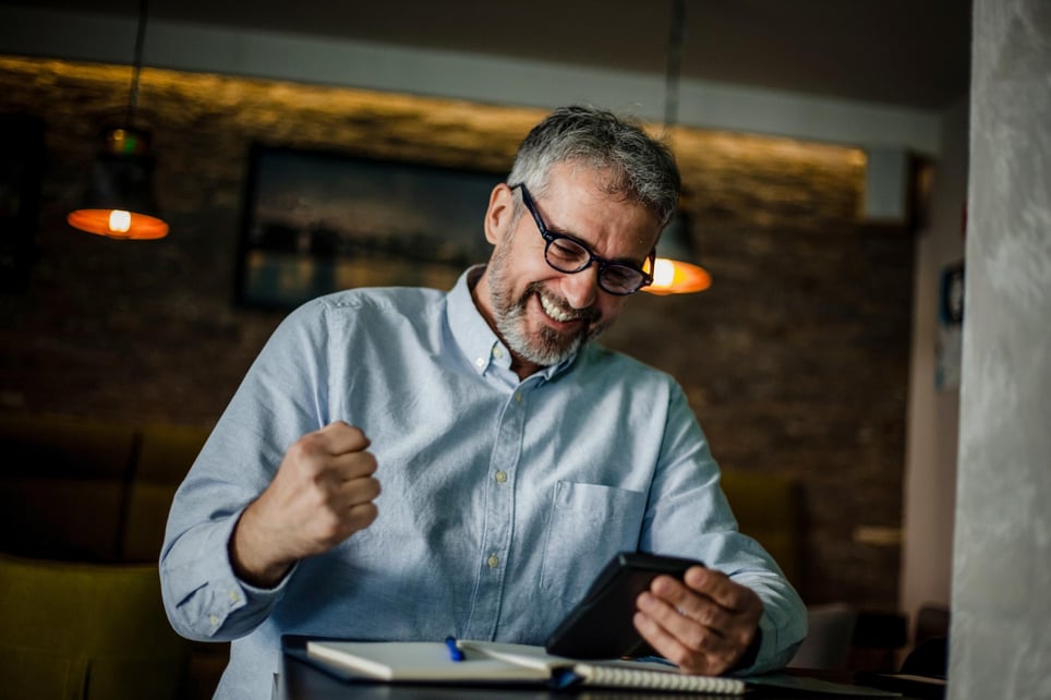 Senior-man-using-mobile-phone-and-digital-tablet-in-cafe-what-is-my-earning-potential