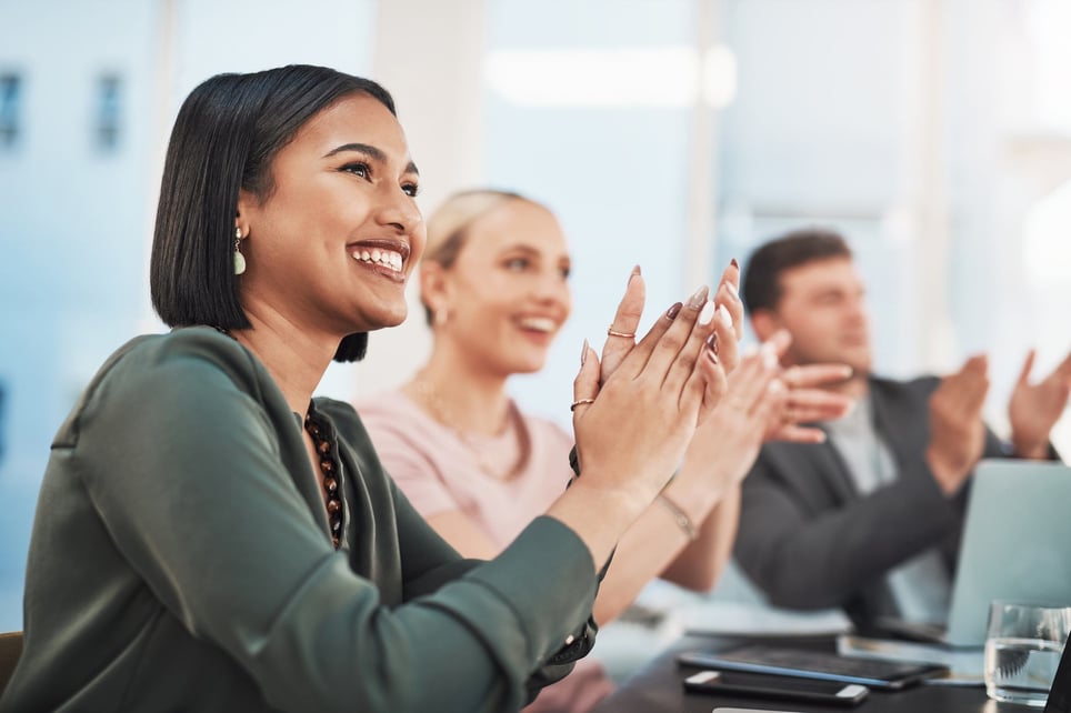 Shot-of-a-group-of-businesspeople-clapping-advantages-of-intrinsic-motivation