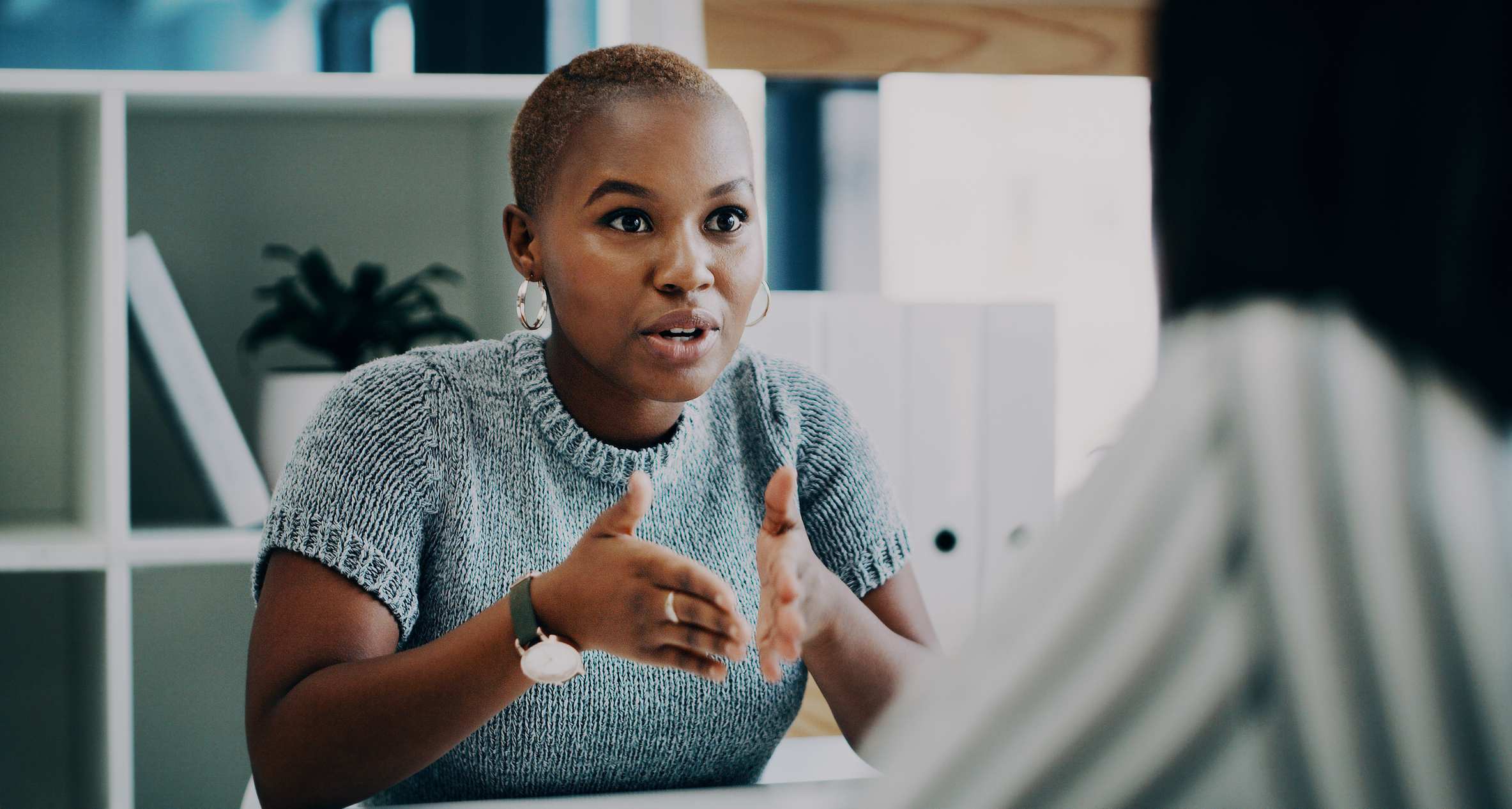 Shot-of-a-young-businesswoman-having-a-discussion-with-a-colleague-in-an-office-characteristics-of-a-determined-person