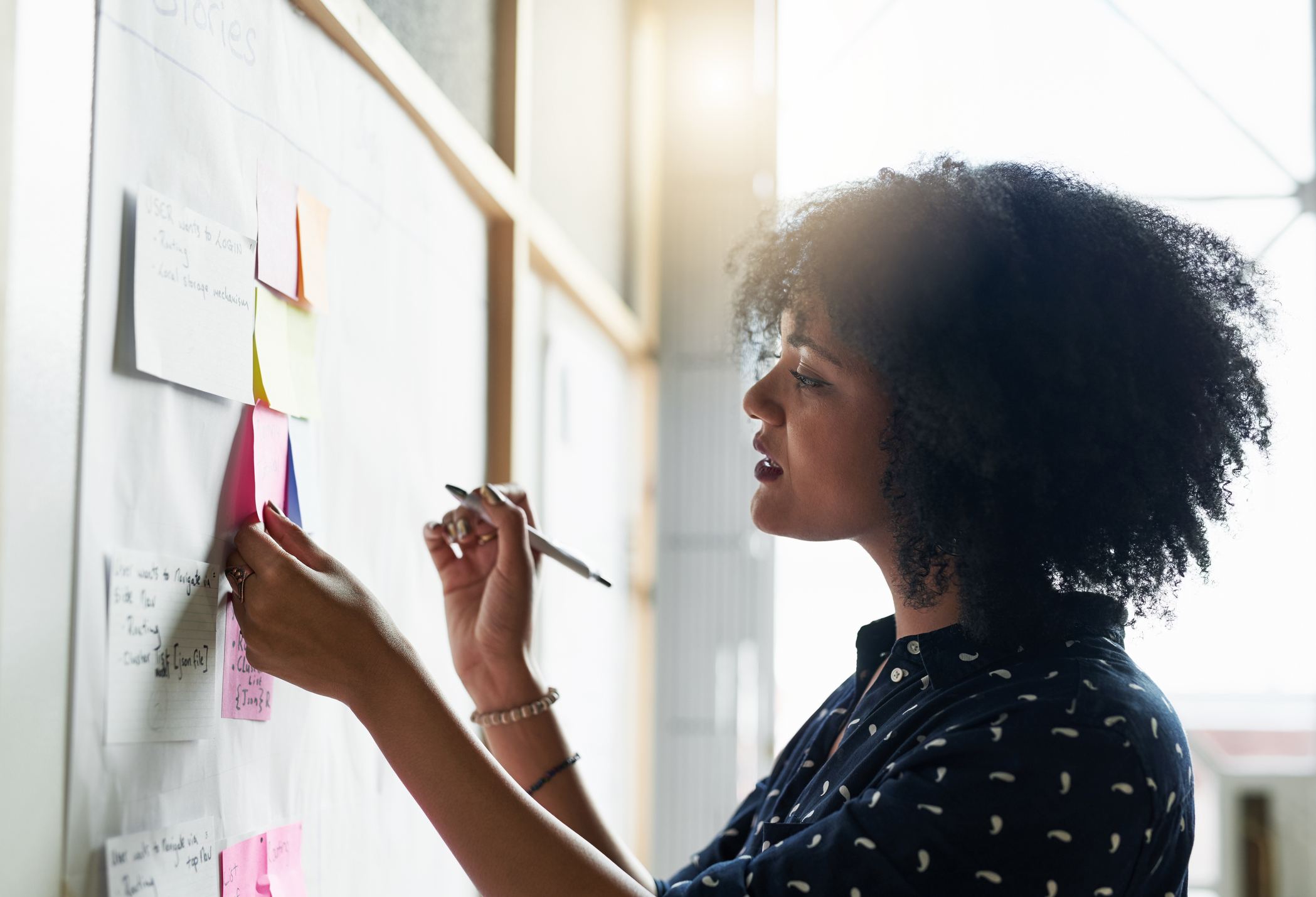 Shot-of-a-young-female-designer-working-in-her-office-asking-for-a-raise-tips