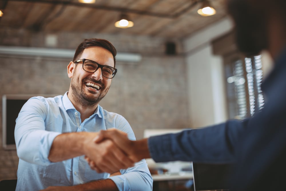 Smiling-man-shaking-hand-of-boss-work-life-balance-in-startups