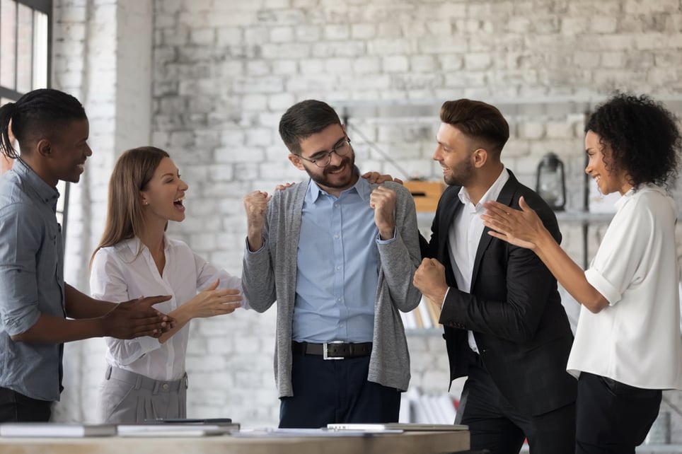 Smiling-multiracial-businesspeople-congratulate-colleague-with-job-success-why-do-we-fear-failure