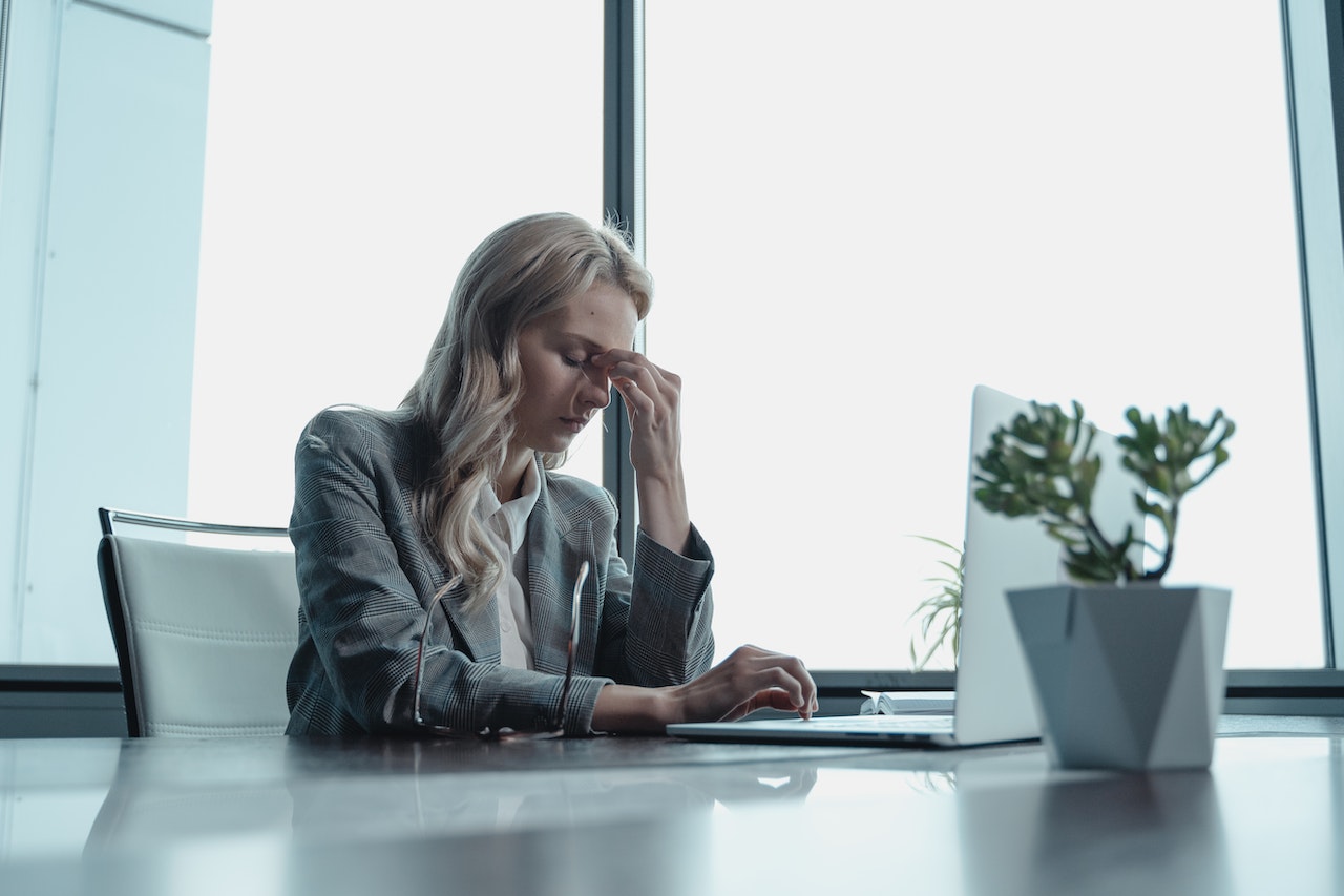 Stressed-woman-at-office-how-to-budget