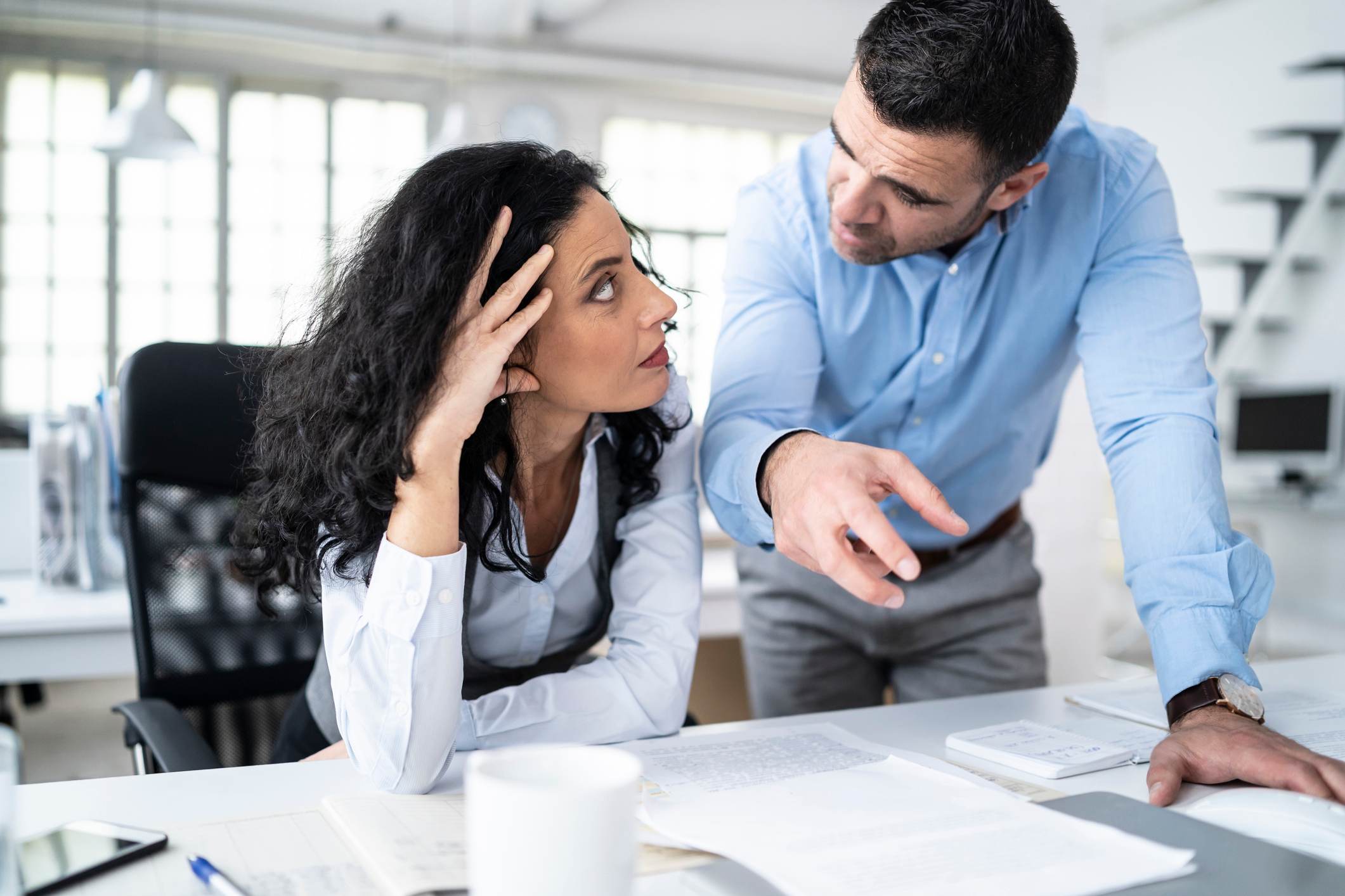 Stressed-woman-being-scolded-by-manager-passive-aggressive-boss