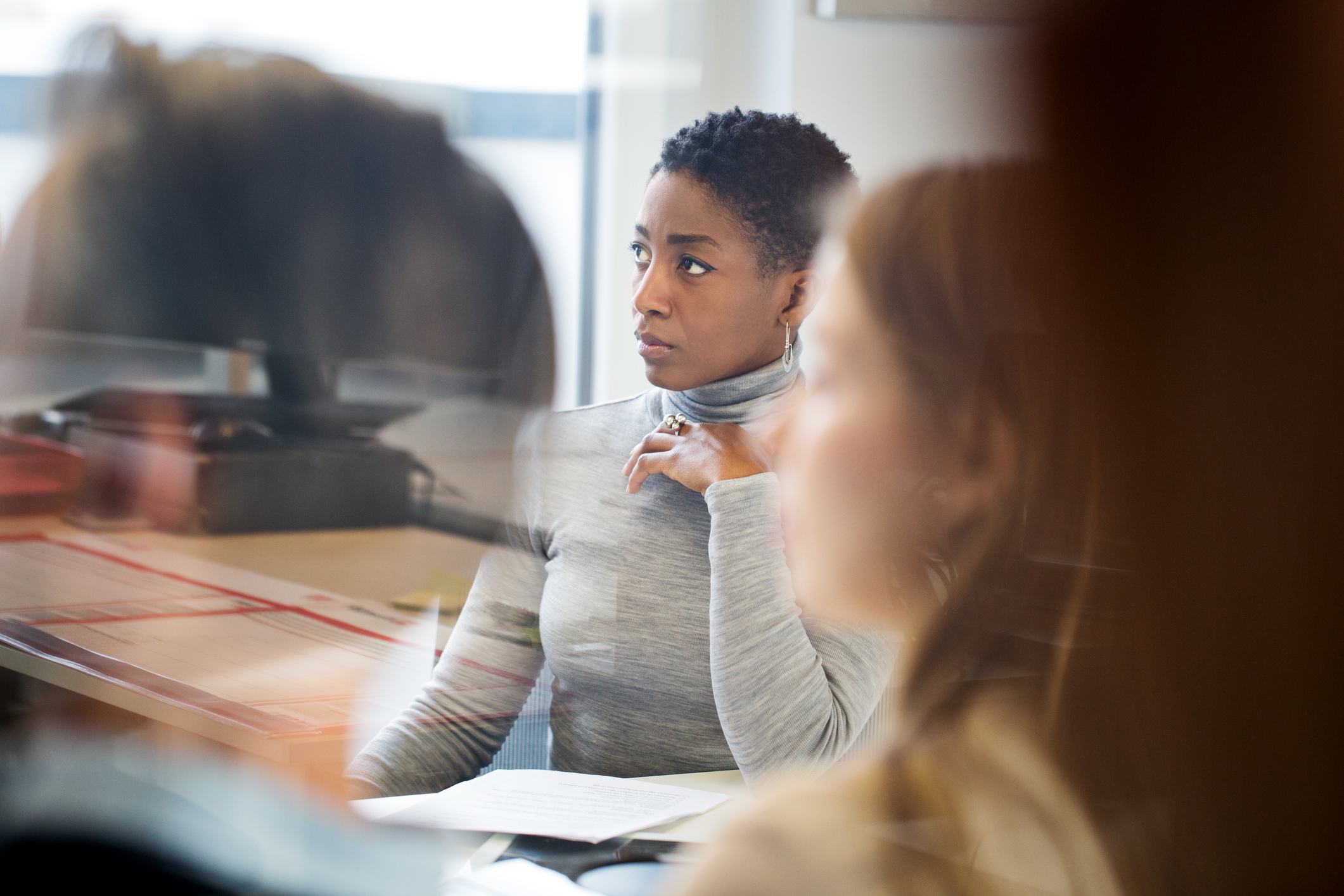 Surprised-woman-at-meeting-i-got-laid-off-without-warning