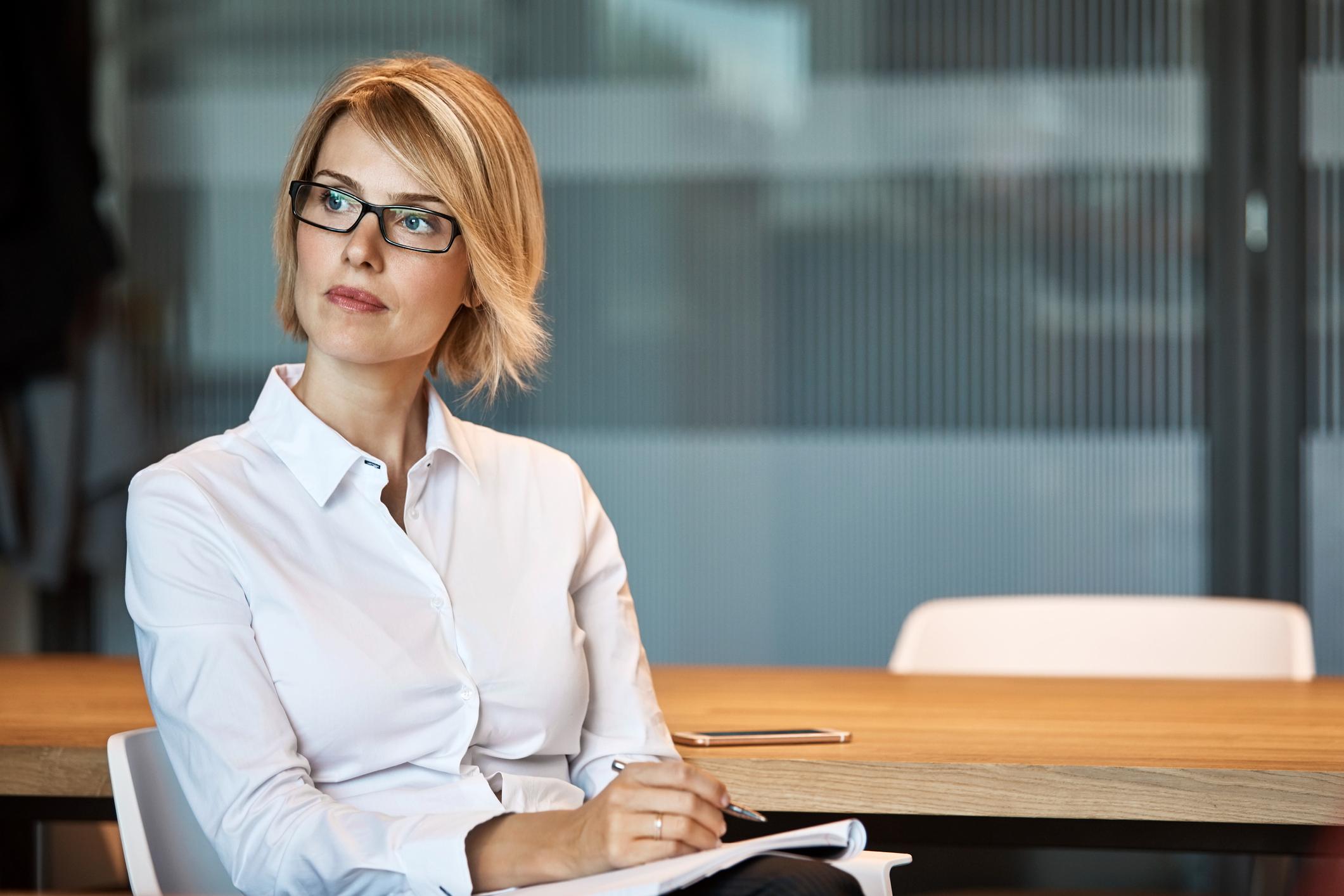 Thoughtful-businesswoman-looking-away-at-desk-signs-you-are-being-pushed-out-of-your-job