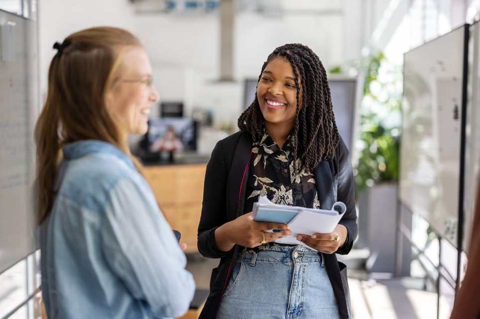 Two-colleagues-meeting-in-hybrid-office-space-asking-for-a-raise-tips