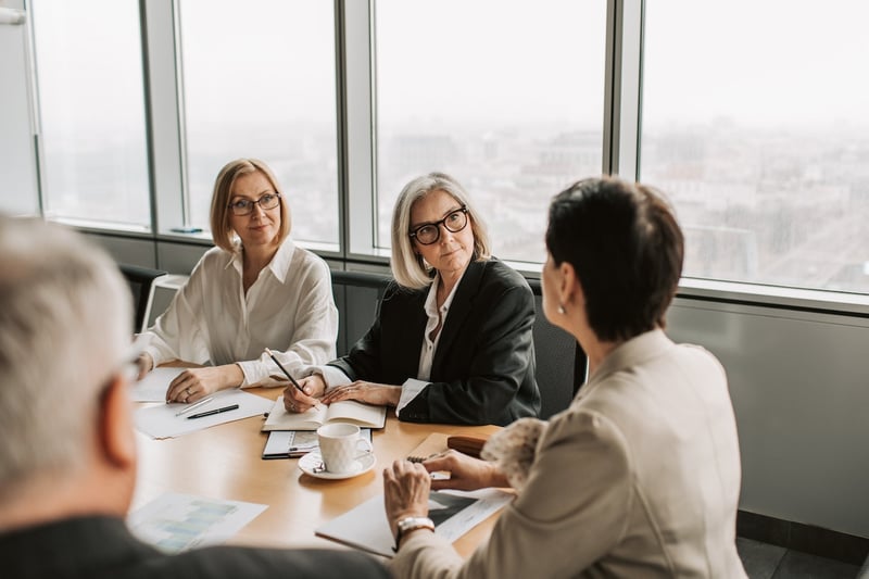 Two-elderly-women-interviewing-someone-for-work-character-references