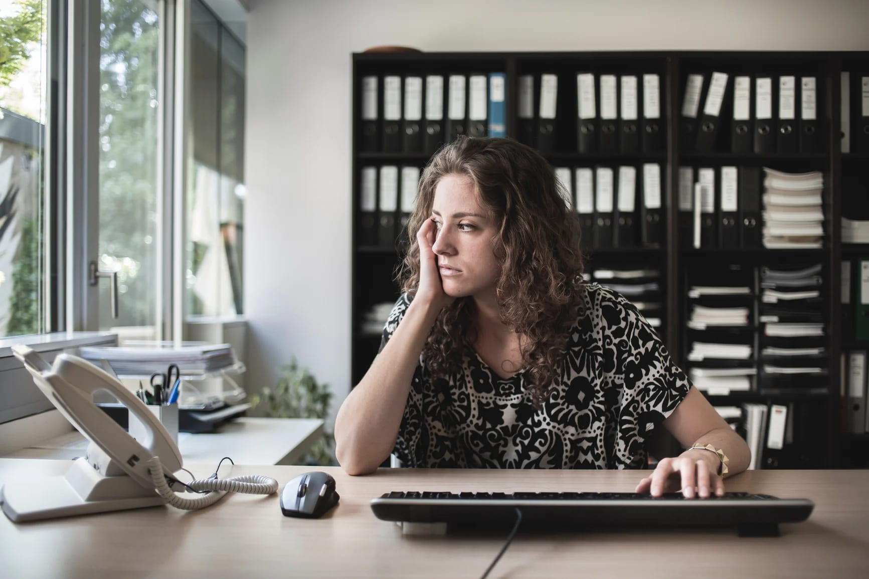 Upset-Girl-Sitting-In-Front-Of-The-Computer-In-Her-Office-toxic-work-environment