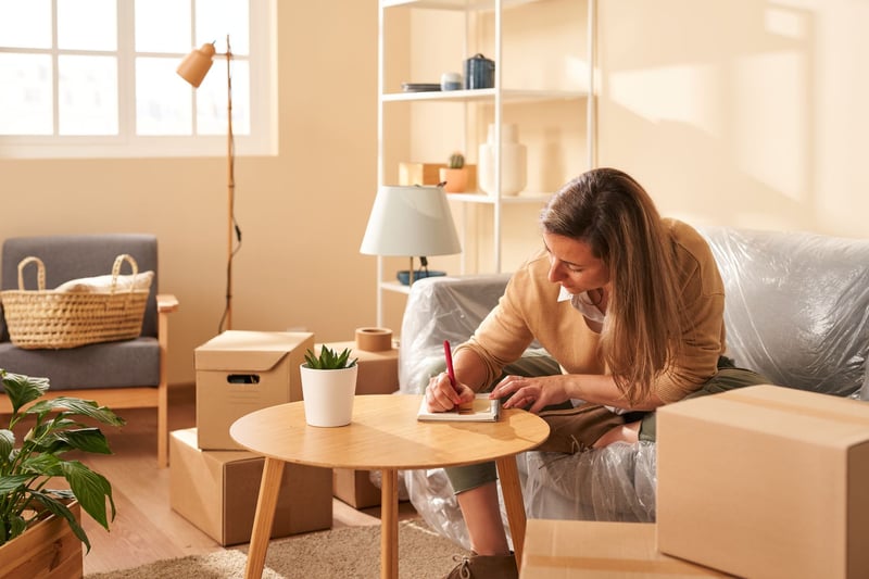 Woman-Making-Notes-During-Relocation