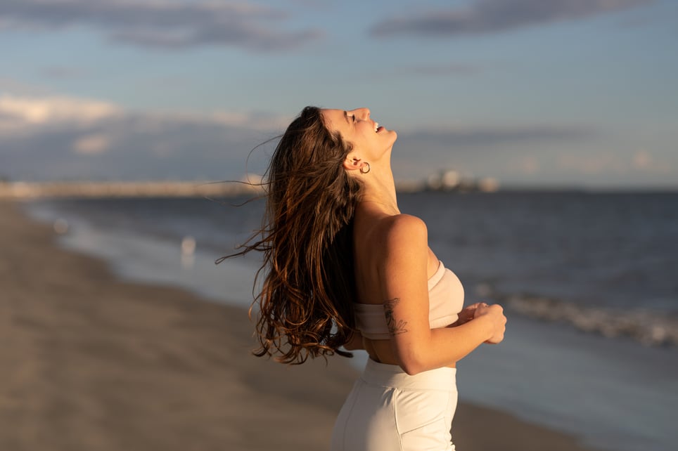 Woman-Smiles-With-Gratitude-On-The-Beach-what-do-i-want