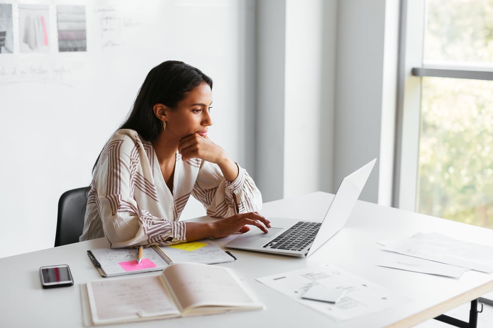 Woman-Using-Laptop-In-Office-how-to-make-your-resume-stand-out