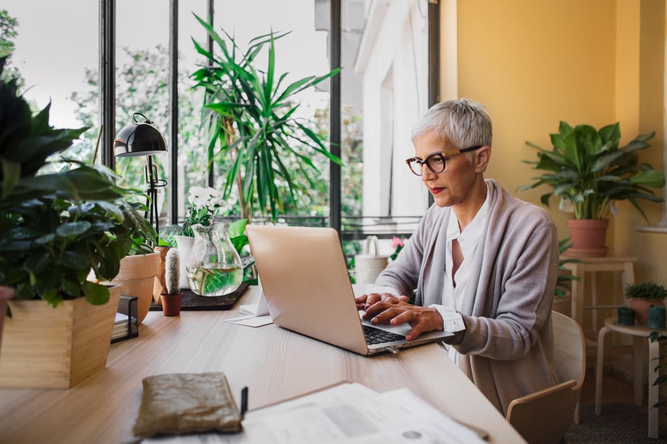 Woman-With-Laptop-In-Office-1