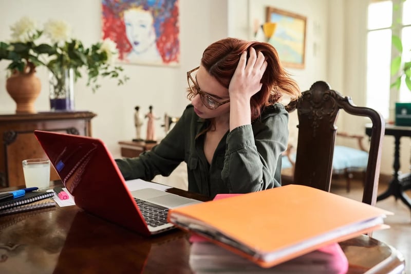 Woman-Working-At-Vintage-Desk-new-job-anxiety