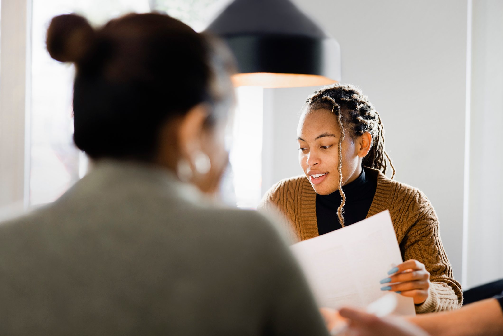 Woman-looking-through-files-email-before-first-day-of-work