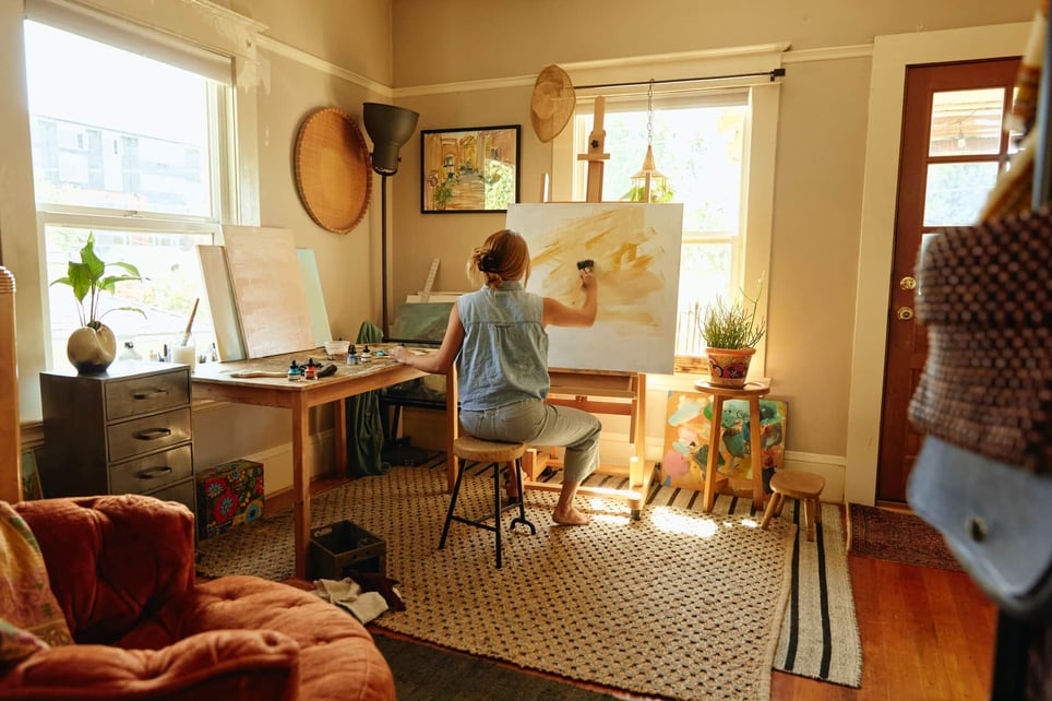 Woman-painting-in-a-home-studio-1