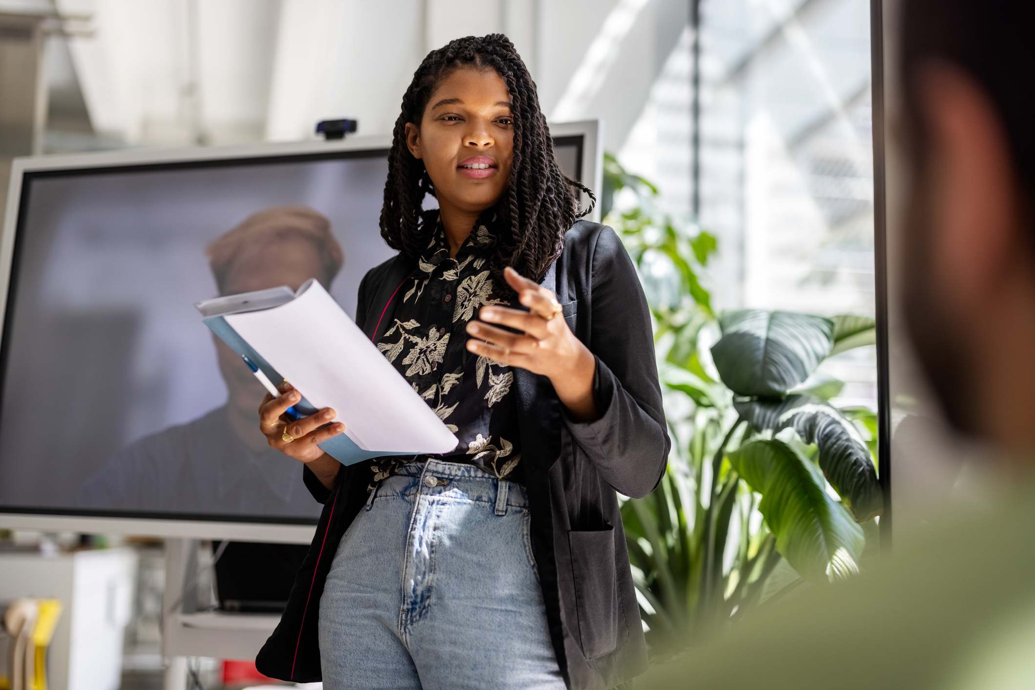 Woman-presenting-project-at-work-promotion-interview-questions