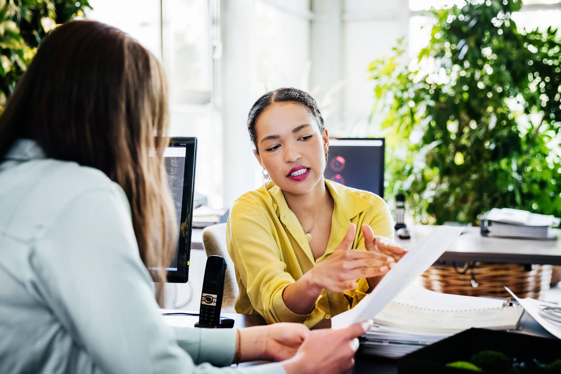 Woman-raising-concerns-about-the-workplace-with-her-manager-employee-poaching