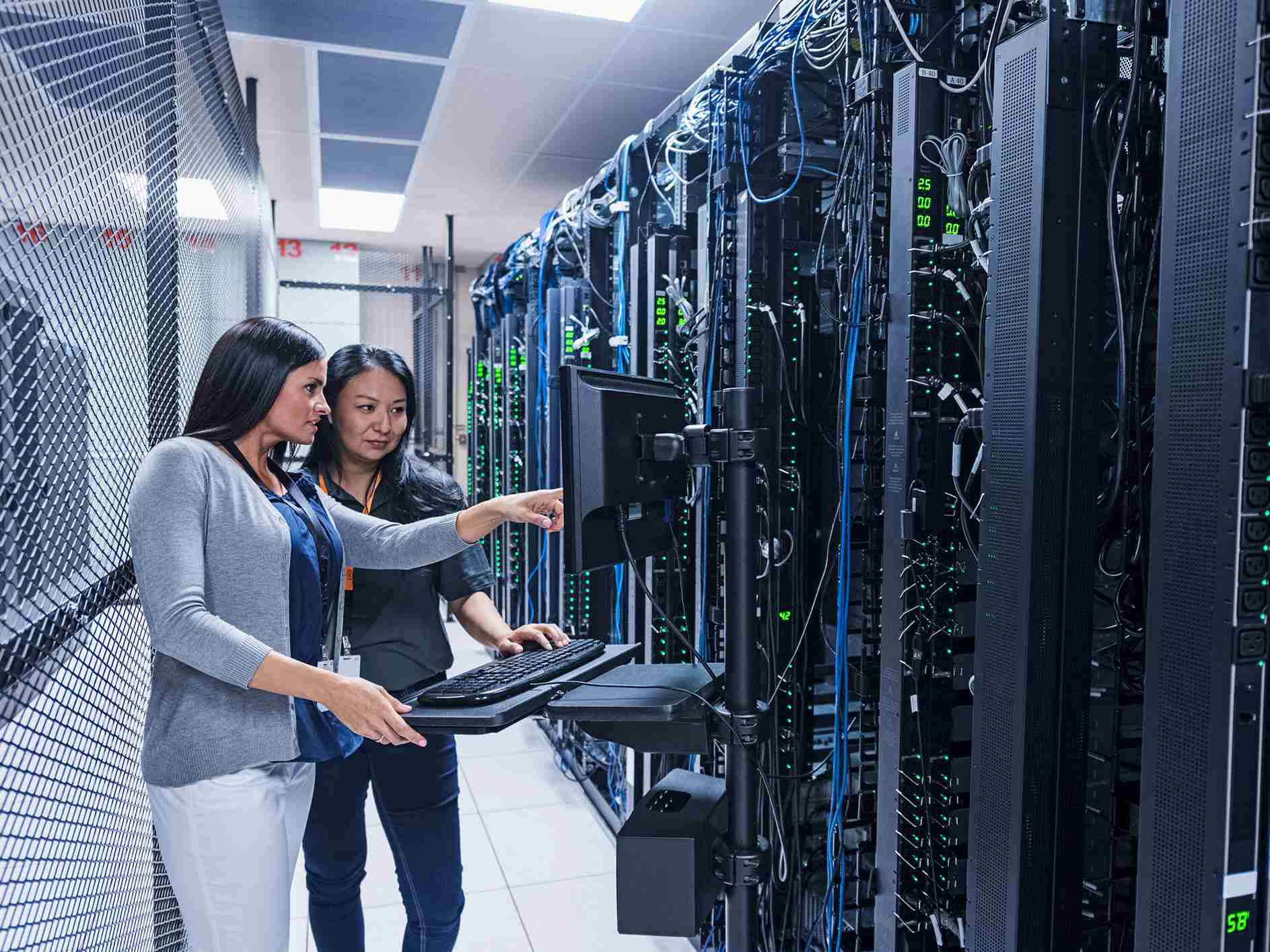 Woman-showing-something-in-technology-lab-to-coworker-subject-matter-expert