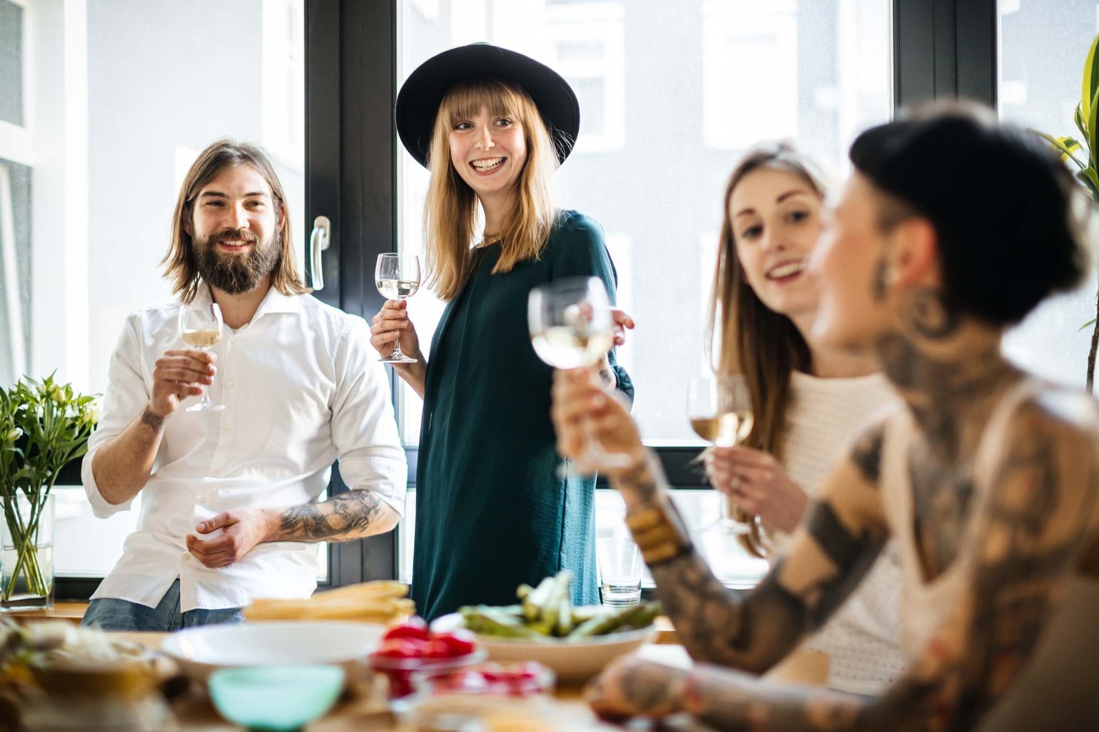 Woman-smiling-in-front-of-group-of-friends-at-party-spotlight-effect