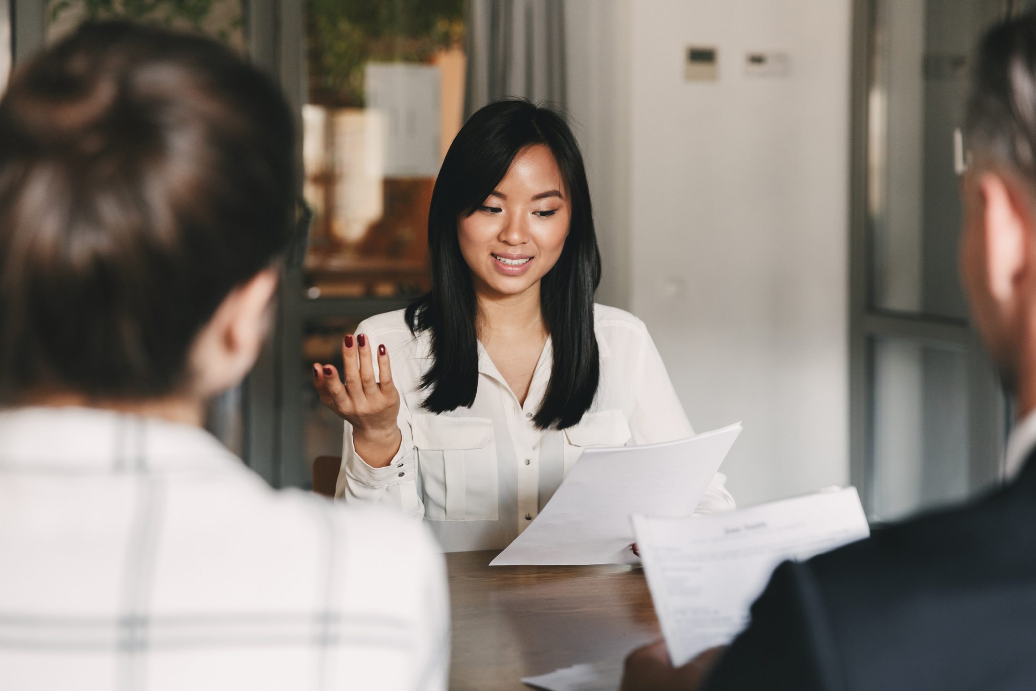 Woman-speaking-with-confidence-at-job-interview-what-motivates-you