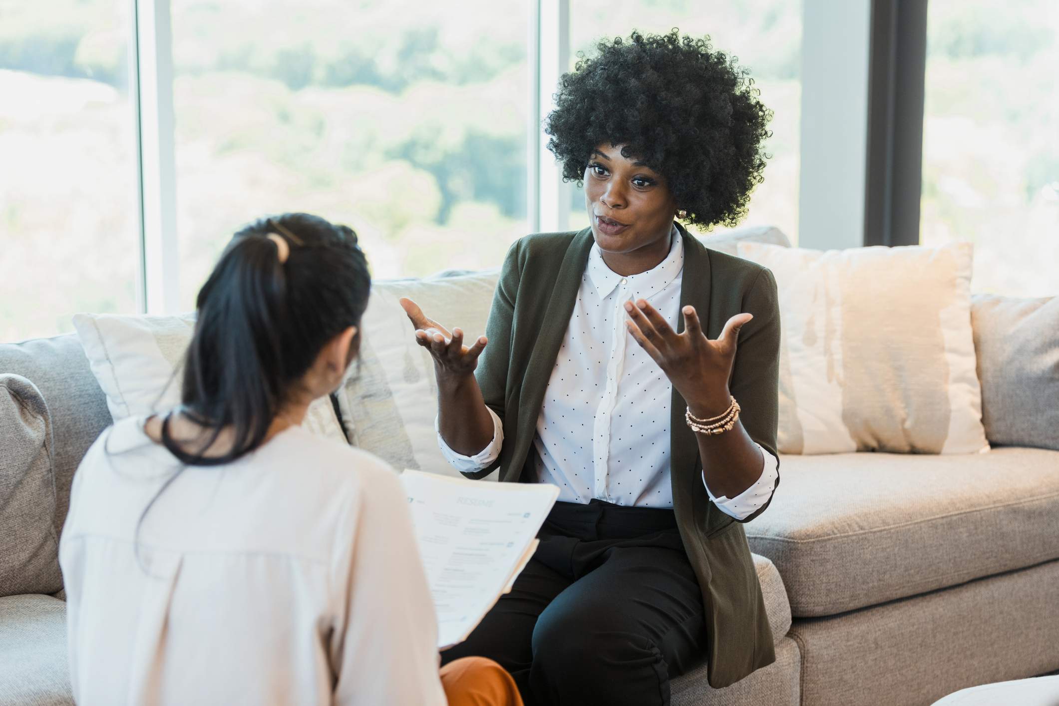 Woman-talking-at-job-interview-is-it-better-to-be-fired-or-quit