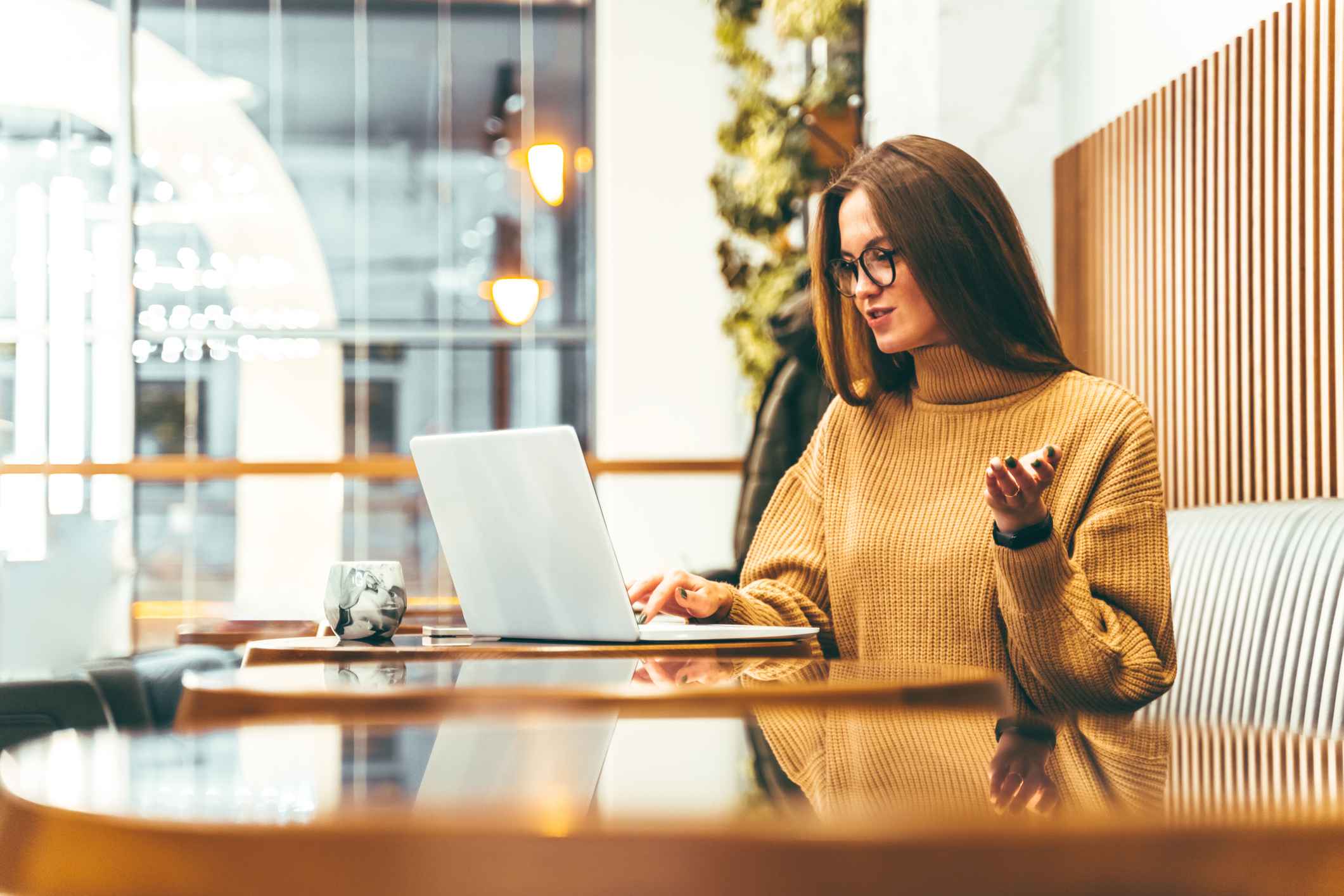 Woman-talking-at-remote-job-interview-problem-solving-questions