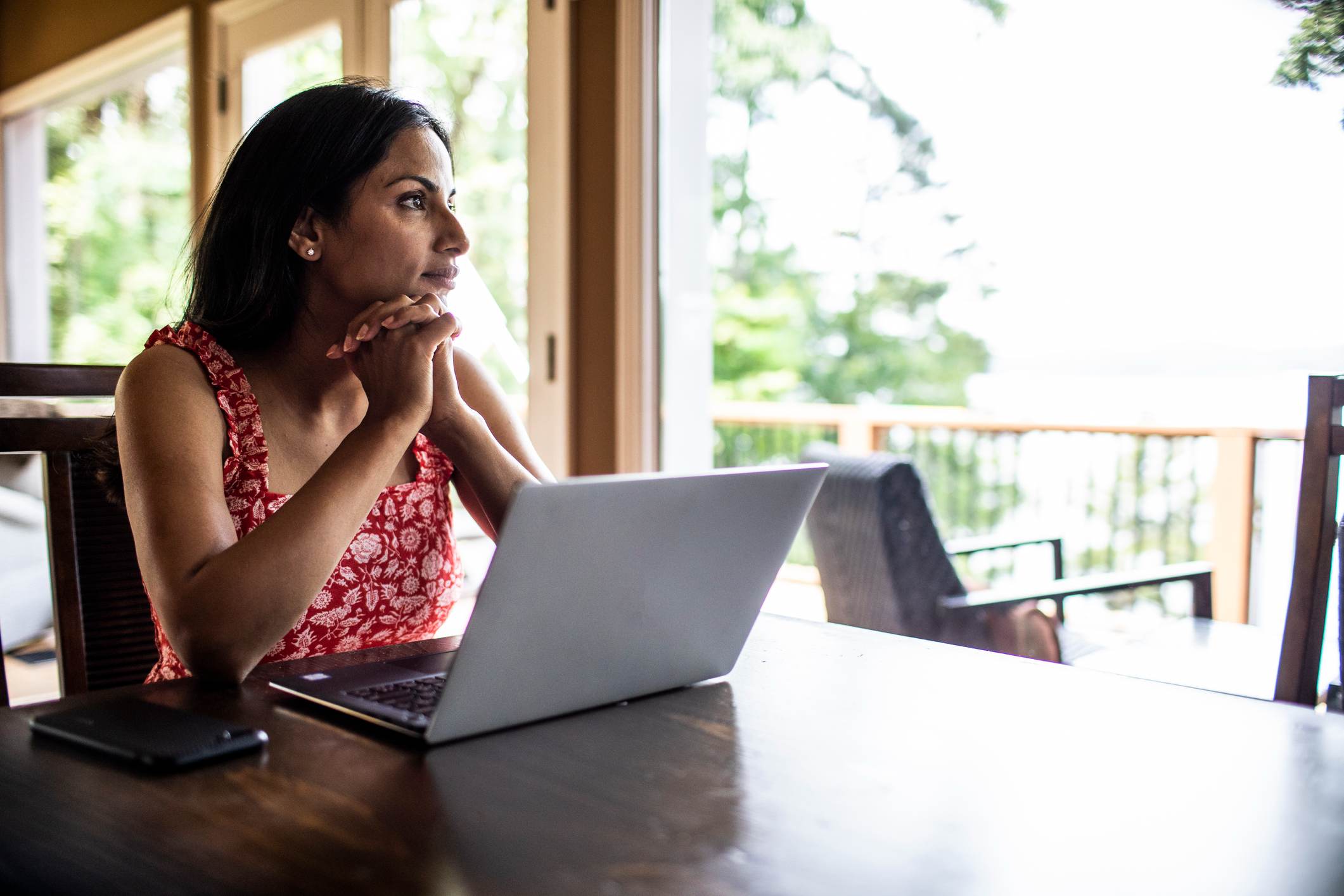 Woman-using-laptop-computer-at-home-what-to-do-if-you-don 't-get-a-promotion