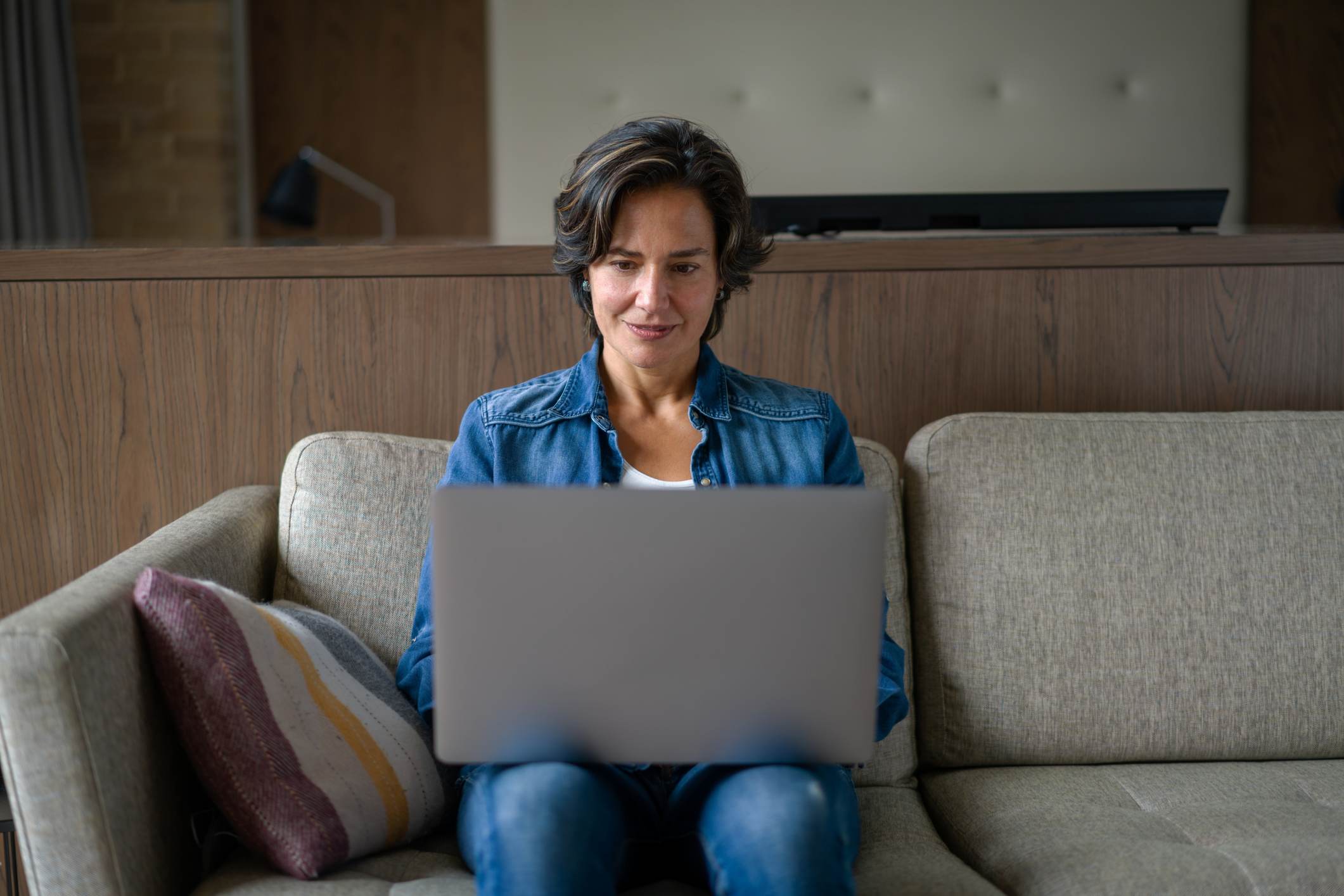 Woman-working-from-home-on-her-laptop-computer-how-to-write-a-professional-email