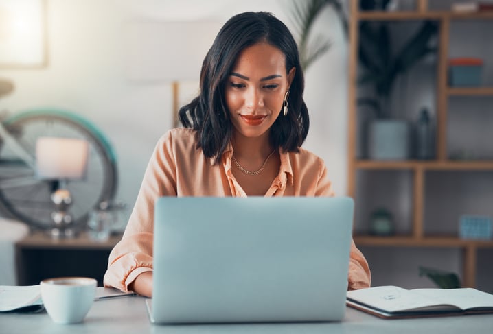 Woman-working-on-laptop-online-letter-of-interest