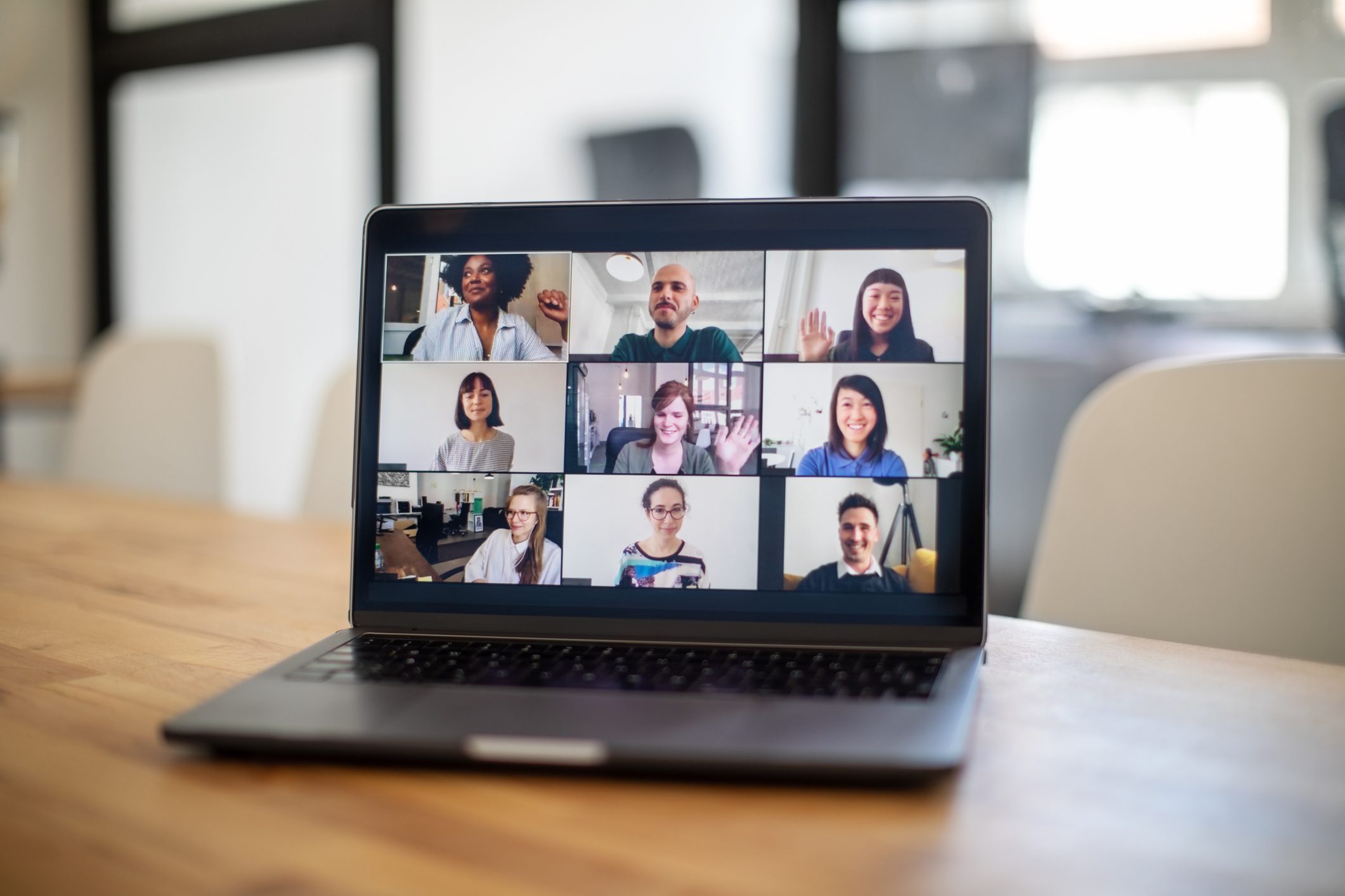 Work-team-introducing-themselves-to-new-hire-via-videocall-email-before-first-day-of-work