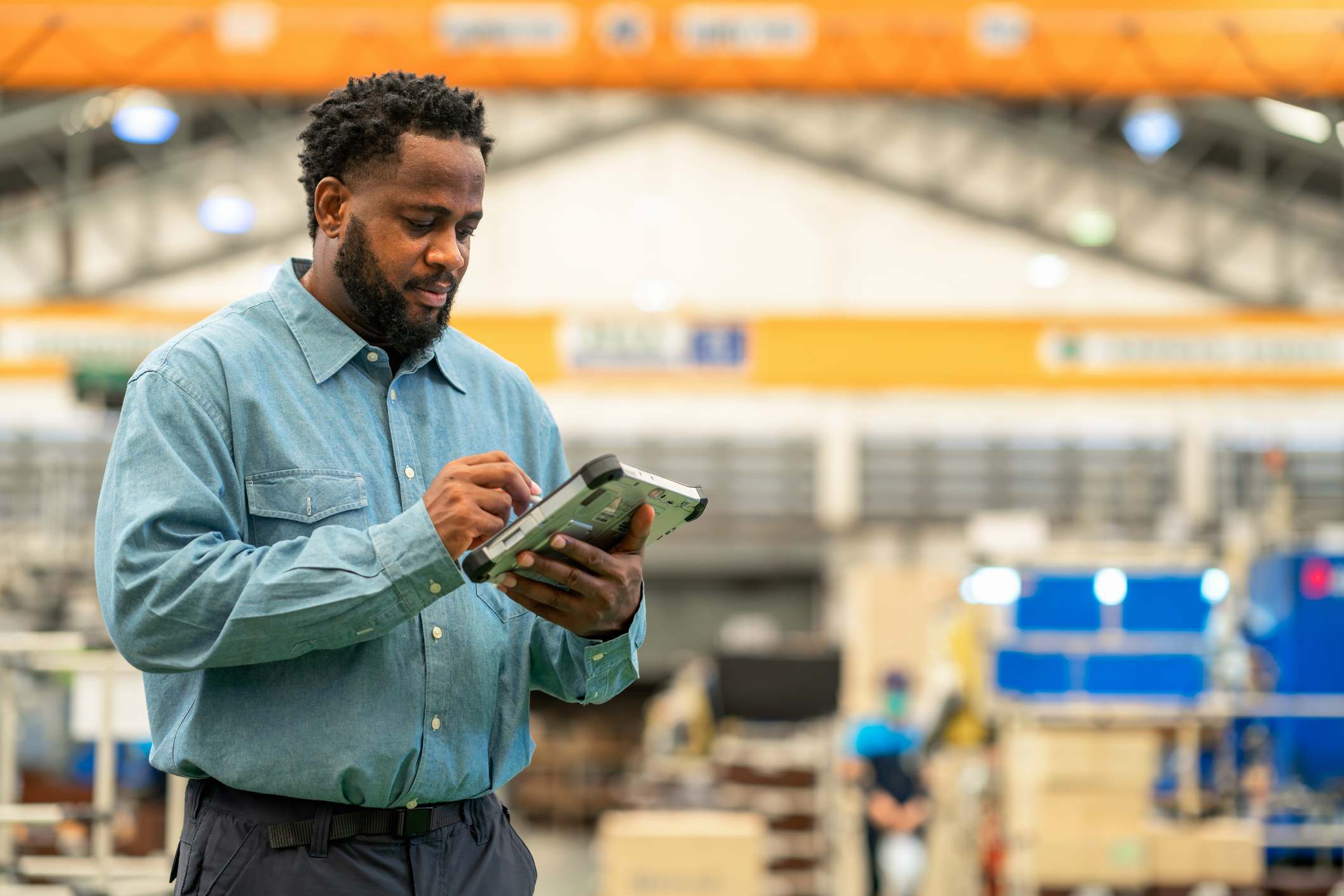 Worker-at-storage-unit-using-a-tablet-office-skills