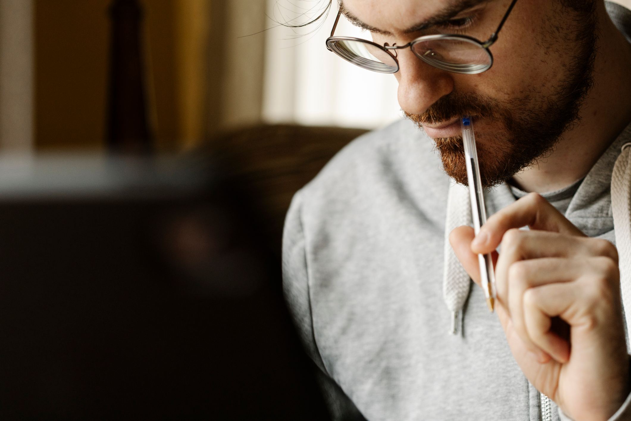 Worried-man-thinking-and-biting-pen-what-is-lateral-thinking