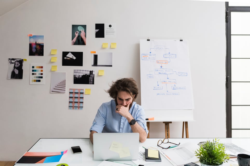 Young-Man-Working-In-Office-how-to-be-more-decisive