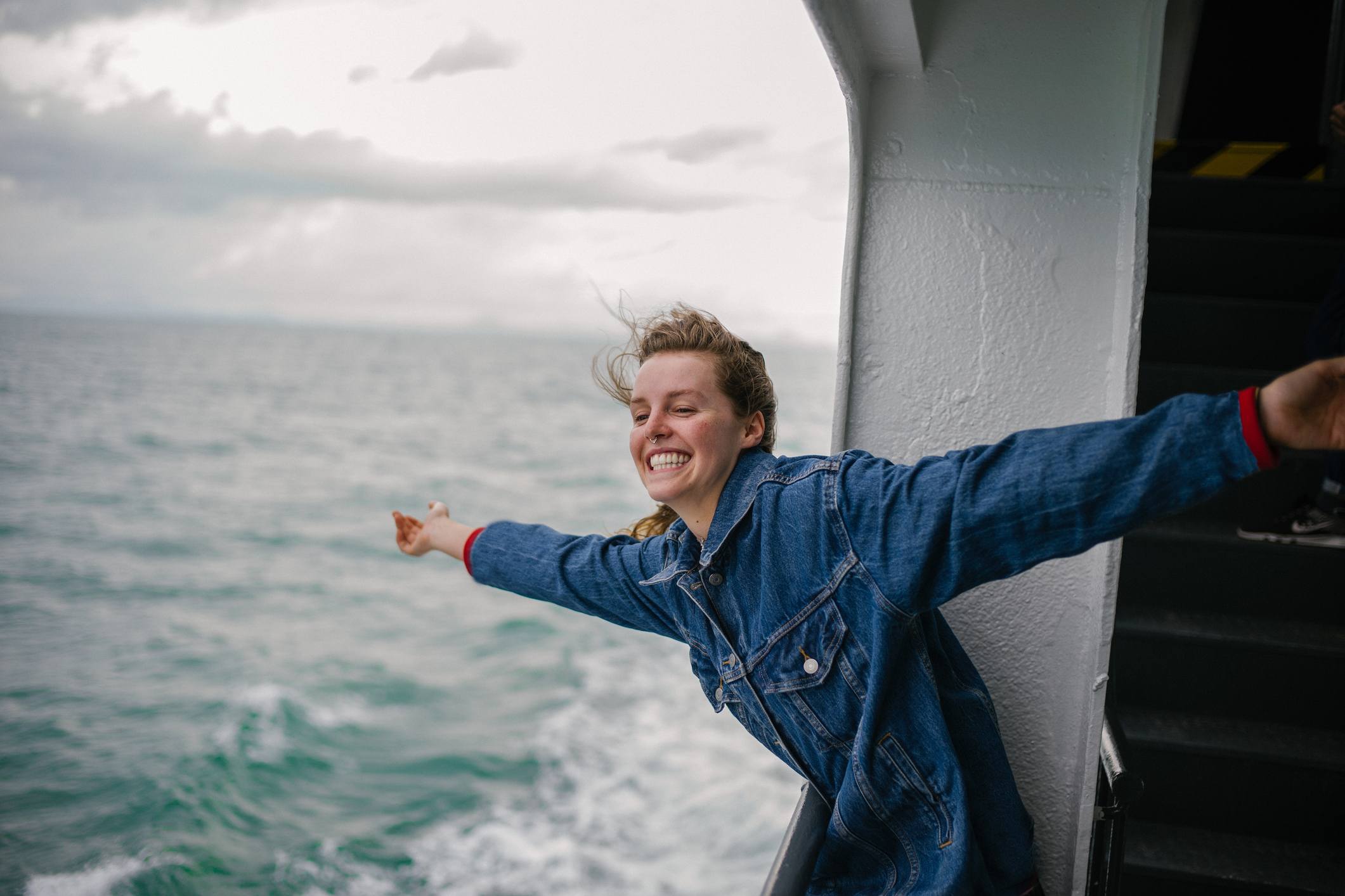 Young-Woman-Enjoying-Life-on-Ferry-how-to-make-life-meaningful