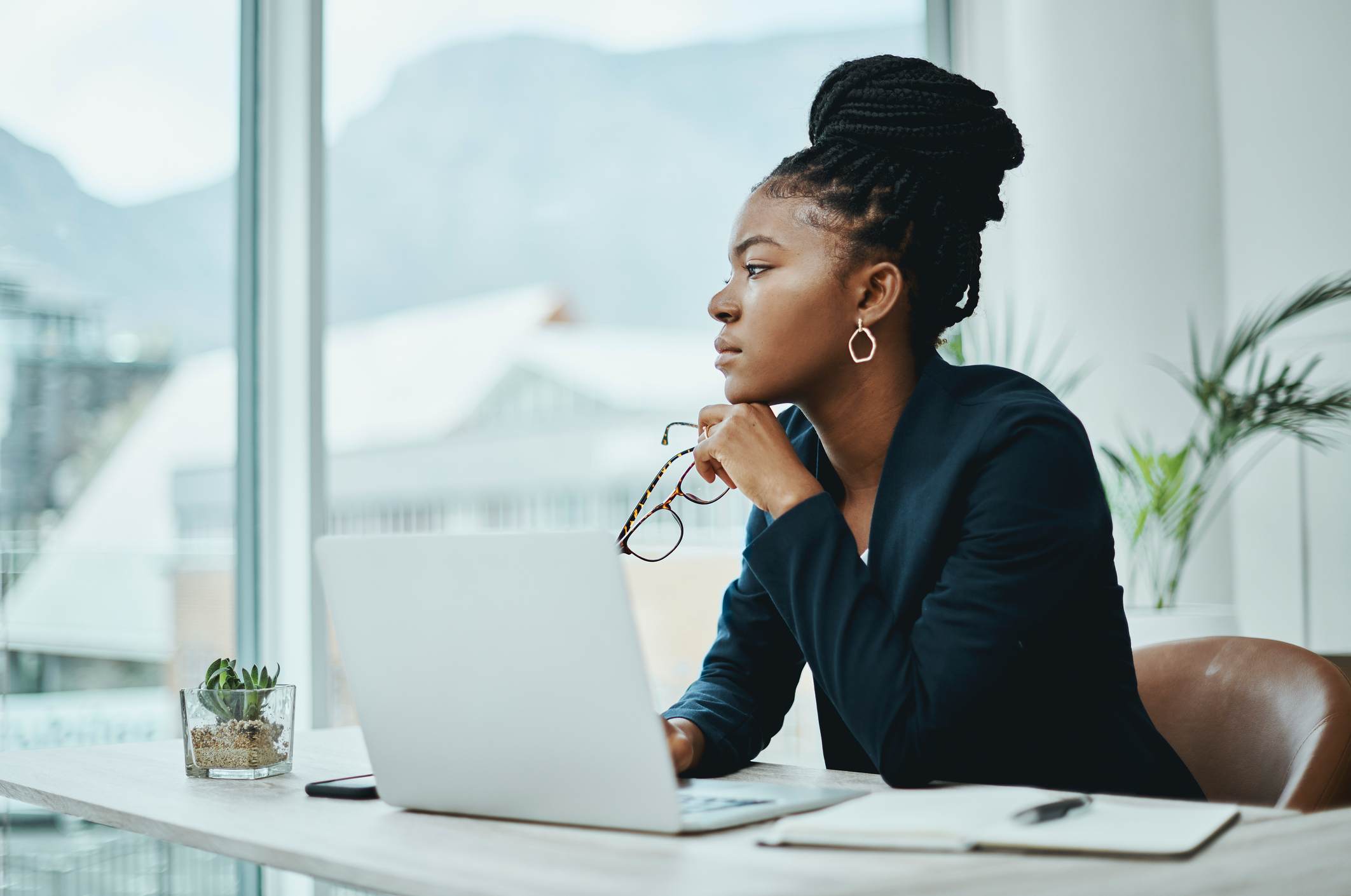 Young-businesswoman-using-a-laptop-how-to-get-noticed-by-upper-management