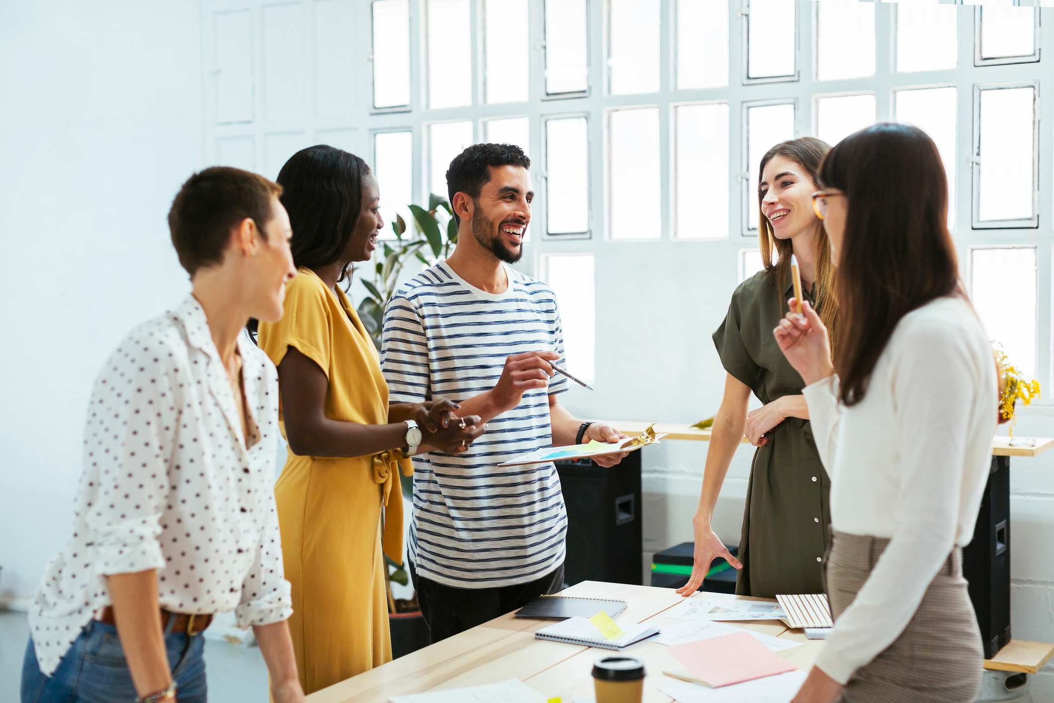 Young-coworkers-smiling-and-doing-team-work-how-to-choose-my-own-life-path-as-a-millennial